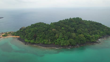 flying backwards revealing the bom beach and resort and the afican coast. ilha do principe,africa