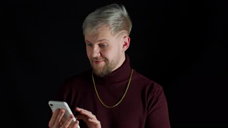 Smiling-happy-stylish-young-man-using-mobile-phone,-look-surprised-wow-feeling-happiness,-enjoyment