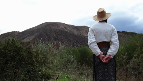 romanian girl looks at the mountain of slag 1