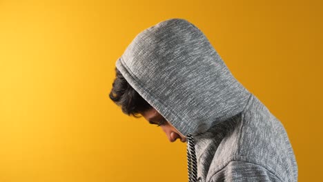 young man wearing gray hoodie