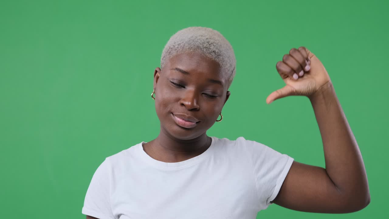 Unhappy woman giving thumbs down gesture