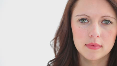 Head-shot-of-smiling-woman-looking-at-the-camera