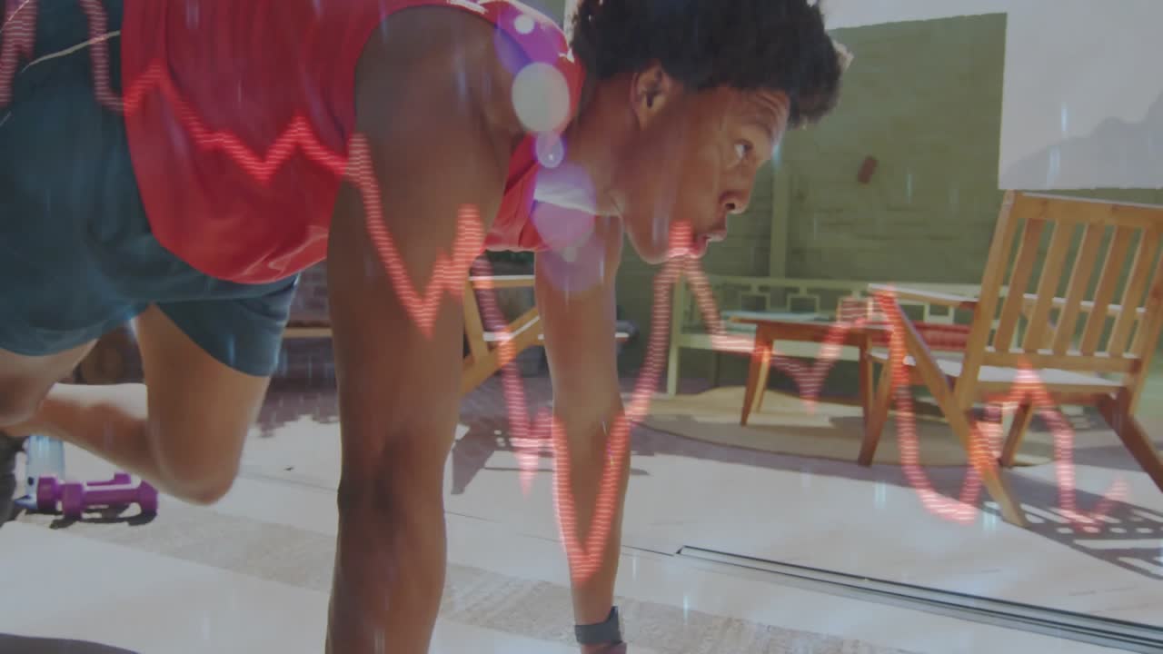 Fitness athlete initiating mountain climbers with waveform graph overlay tracking performance
