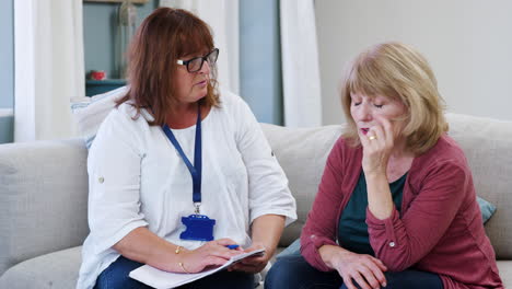 support worker visits senior woman suffering with depression