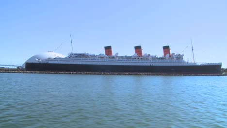 pov from a boat near the queen mary in long beach harbor