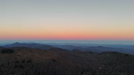 breathtaking sunset over tranquil islands viewed from a serene mountain top witness the stunning hues of dusk as the sun sets over remote islands casting a warm glow across the tranquil sea and surrounding mountains