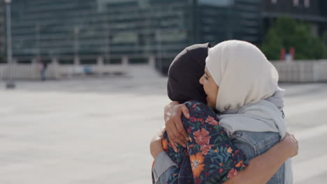 portrait happy muslim woman mother hugging daughter smiling enjoying hugging in city cheerful family reunion