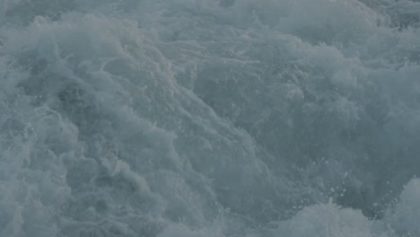 Slow-motion-shot-of-water-churning-from-a-vessel-underway