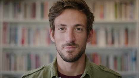 close up portrait attractive young man looking serious pensive handsome caucasian male in bookshelf background