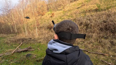 young boy flying his drone