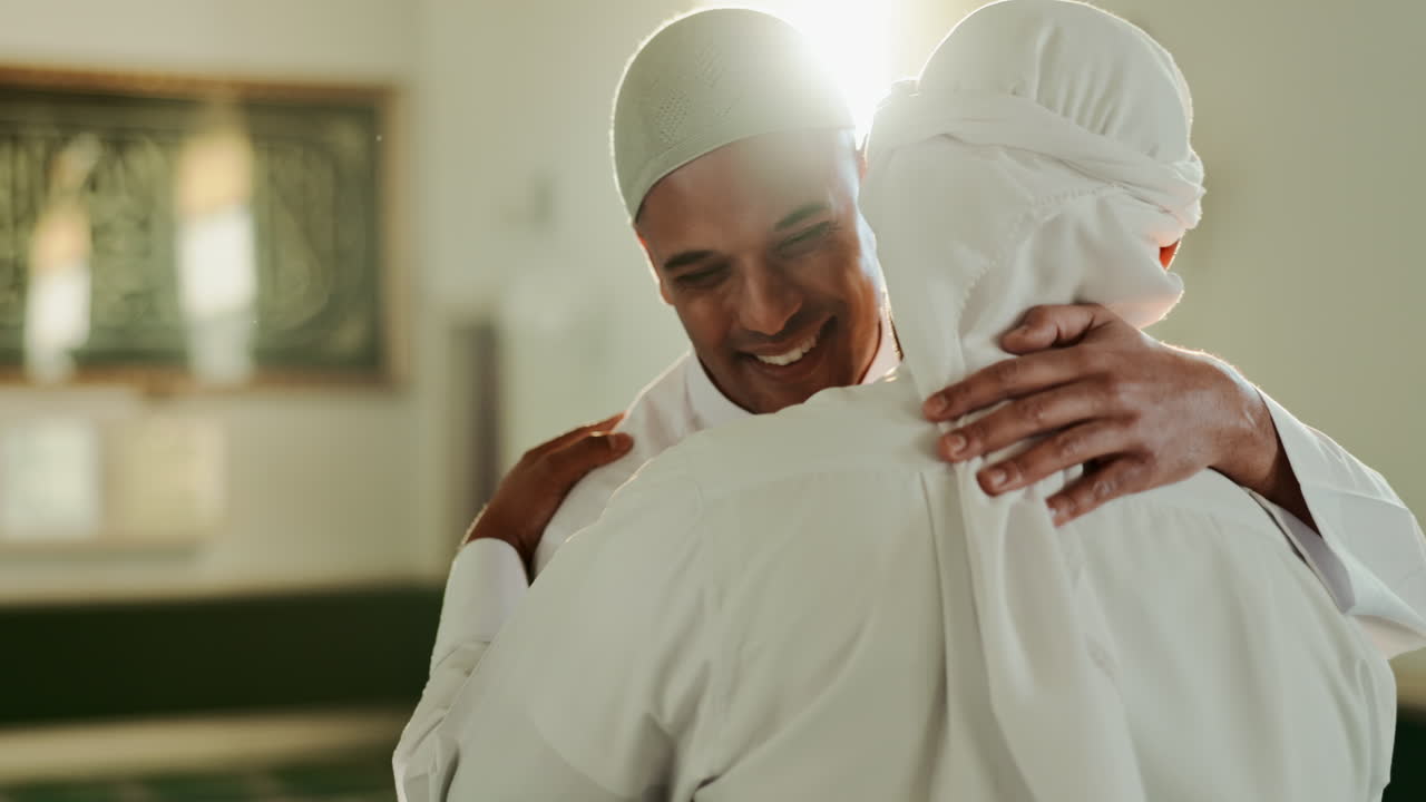 Two Muslim men hugging in a mosque