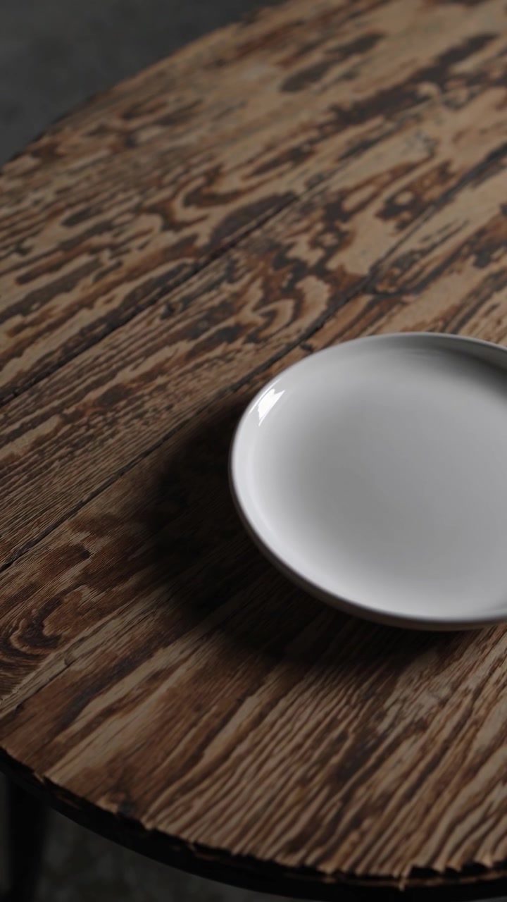Empty White Plate on a Rustic Wooden Table
