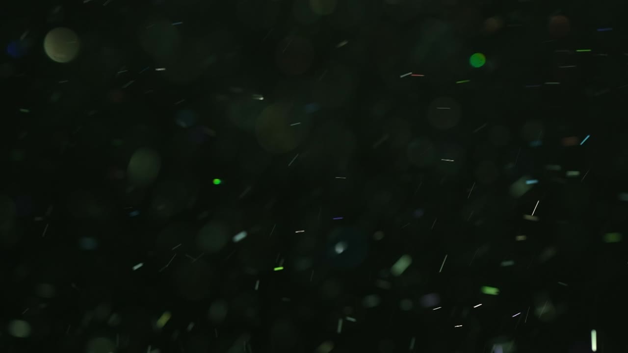 el salto de partículas coloridas en cámara lenta