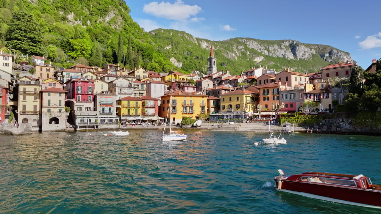 Boats on the shore of the village near Lake Como Varenna, Italy