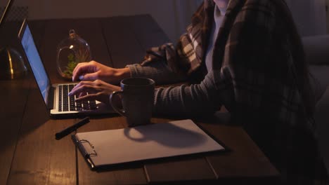 woman working late at night at home