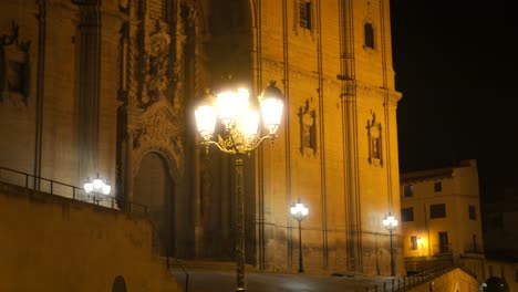 Vintage-Street-Lamps-Illuminated-At-Night-In-The-Historic-Spanish-Town-Of-Alcañiz,-Spain