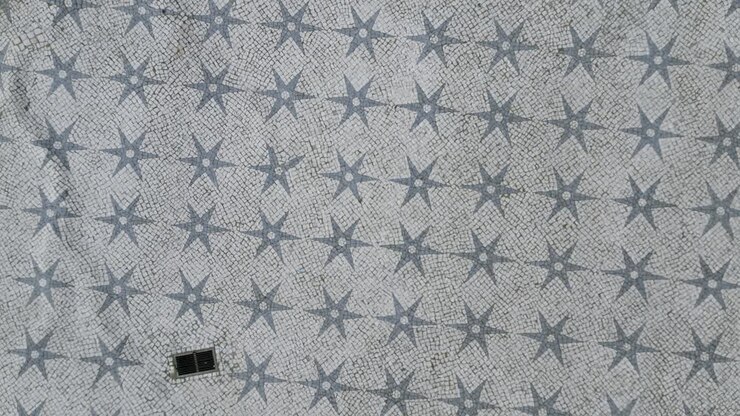 aerial orbit ascending cinematic soaring view of historical Lisbon mosaic, Portugal