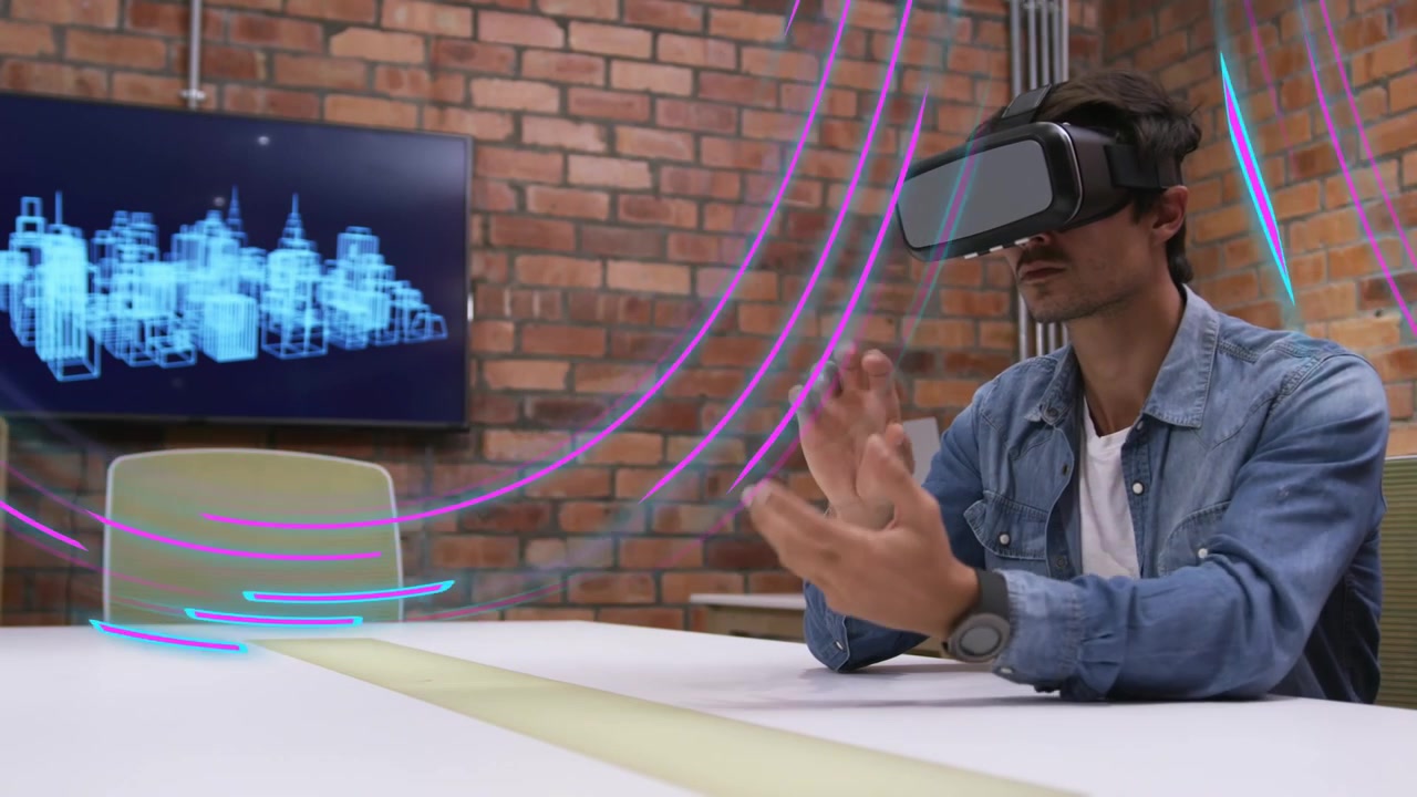 Man wearing VR headset neon trails appearing gesturing and controlling wireframe city for tech demo