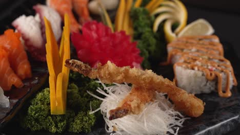 A refined selection of tempura rolls, fresh sashimi, and savory nigiri. 세련된 튀김 롤, 신선한 사시미, 맛있는 초밥을 맛보세요.
