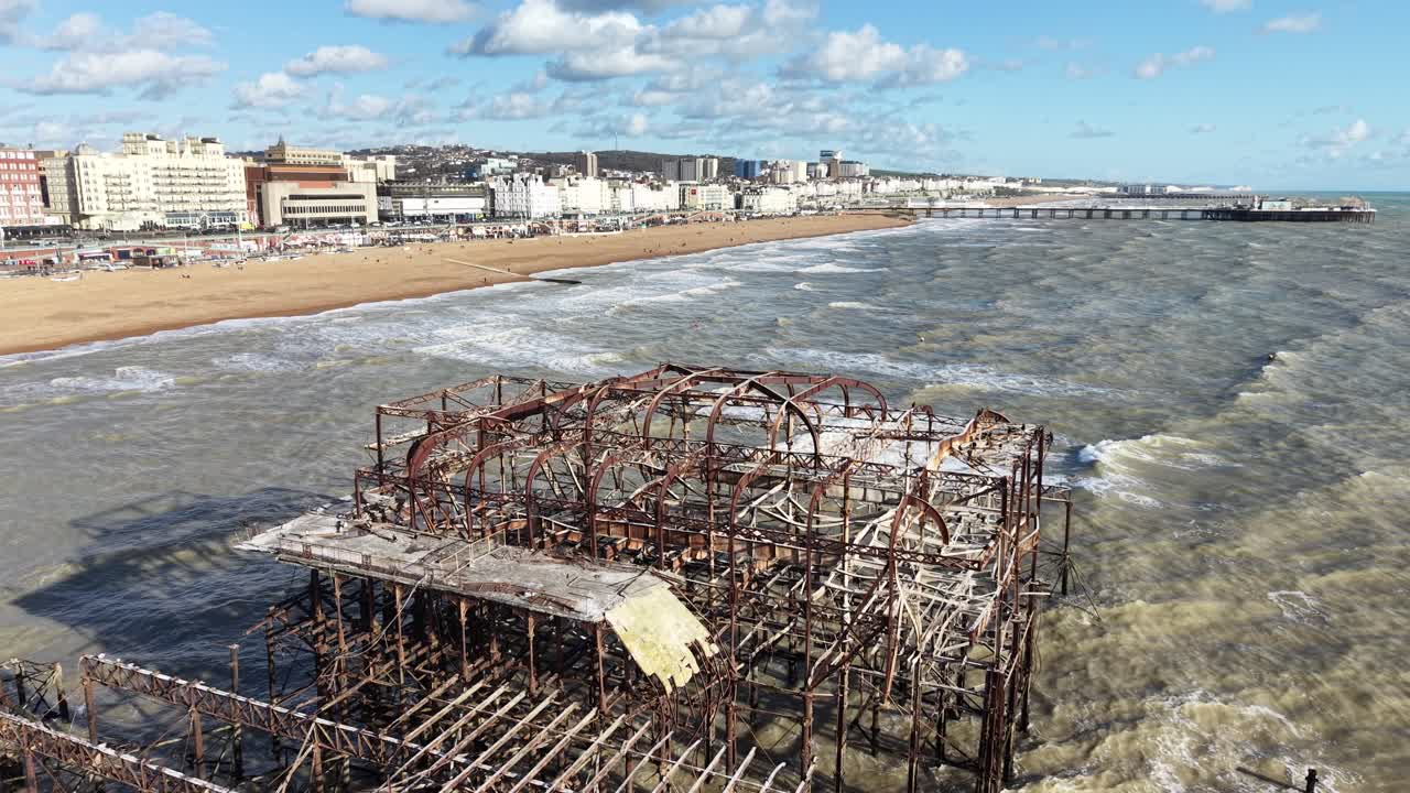 The West Pier ruined pier in Brighton, UK drone,aerial rough seas