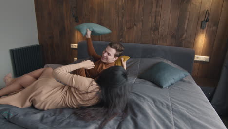 couple enjoying playful moments in bedroom