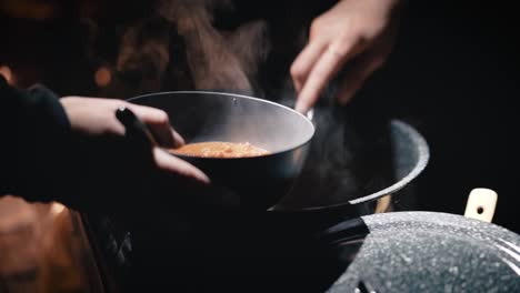 chili served hot and steamy to camper for dinner