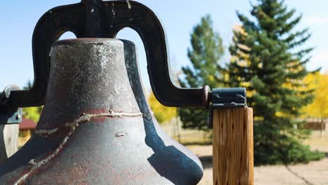 close up of a vintage cast iron bell outdoor