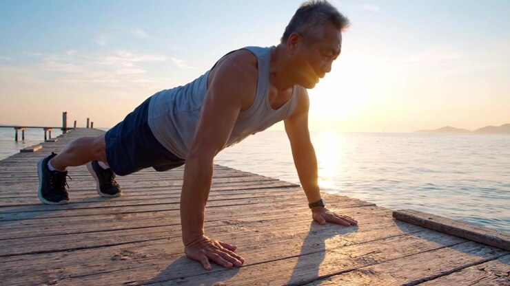 A Dedicated Individual Engages in Intense Push-Up Workout on a Scenic Pier at Sunset, Embracing Fitness and Nature in Unison