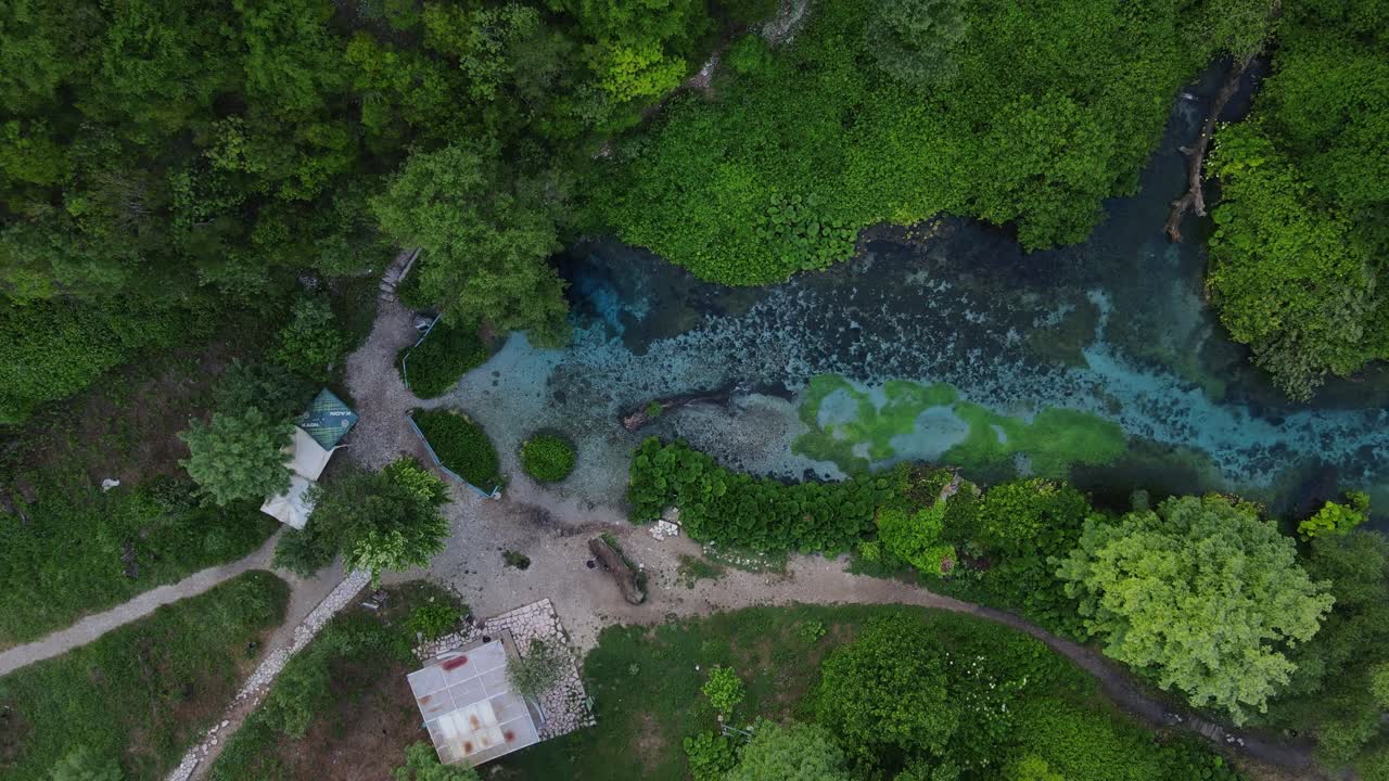 Aerial rising over Blue eye spring a natural phenomenon in Albania