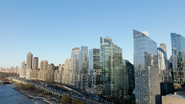 Reflecting apartments on the coastline of Hudson river, spring in Riverside Blvd, New York - Aerial view