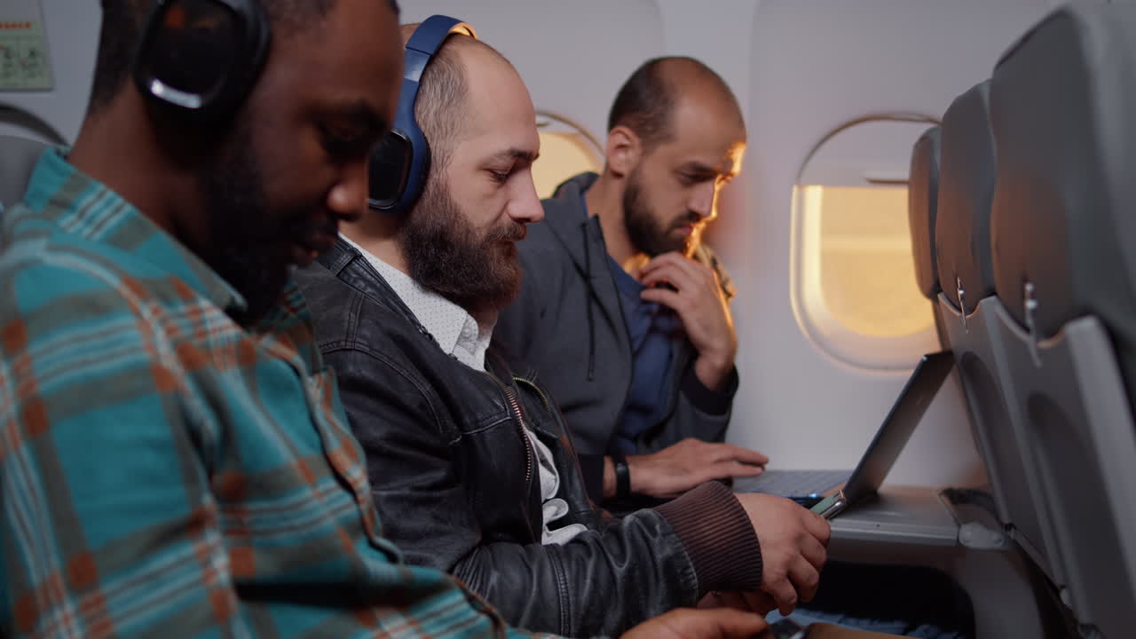 Entrepreneur browsing internet on smartphone during flight