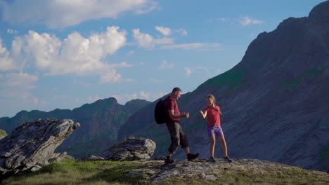 father and daughter are traveling in the mountains