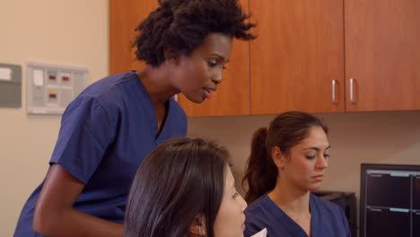 medical team meet at nurses station in hospital shot on r3d