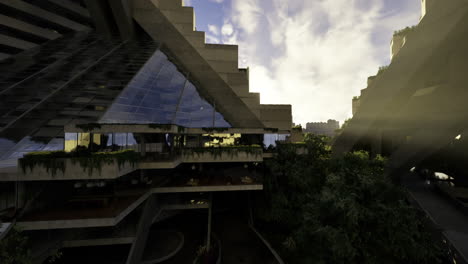 Modern architectural design highlights greenery in urban landscape at sunset