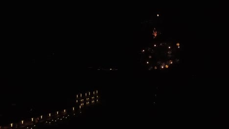 firework display in front of large hotel