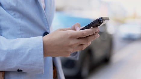 phone, city and closeup of hands typing a text