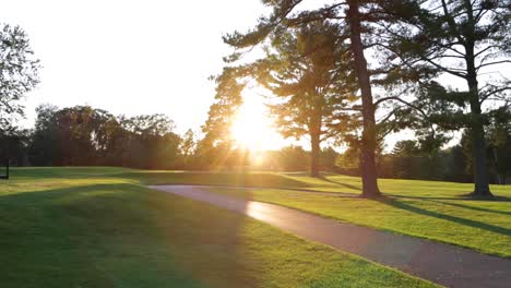 I-smooth-slow-motion-shot-of-the-sunset-on-a-golf-course