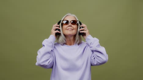 stylish senior woman listening to music