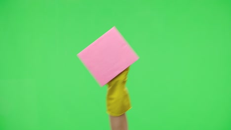 person holding a pink cleaning cloth