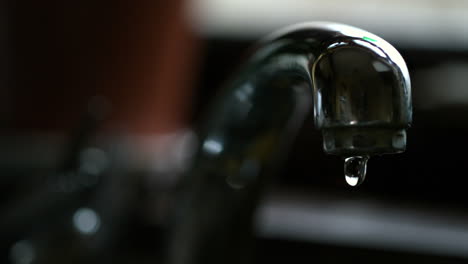 water dripping from a chrome tap