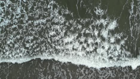 aerial top shot of waves on baltic sea