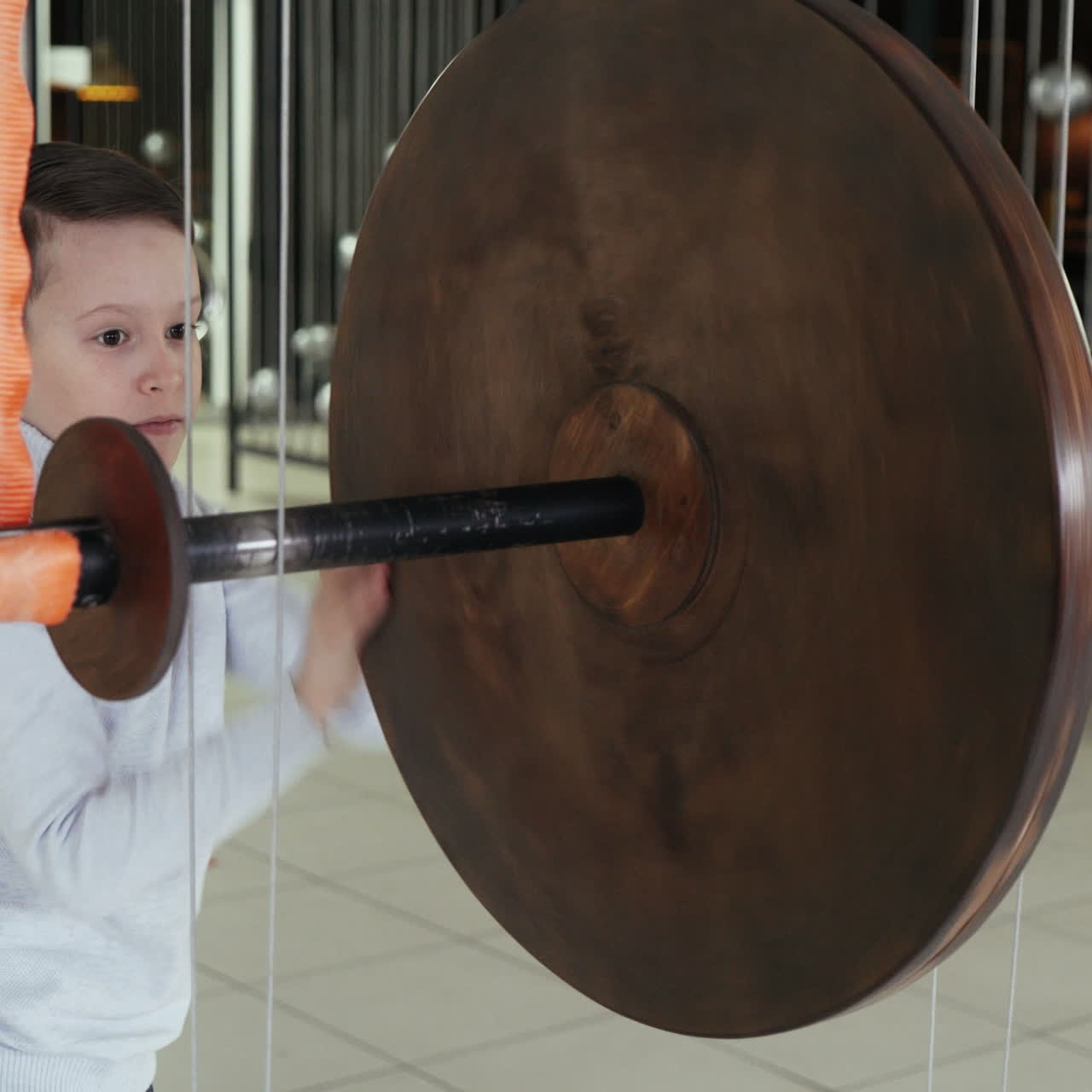 Mechanical conservation of energy. Maxwell's wheel. Boy conducts research experience. Square video