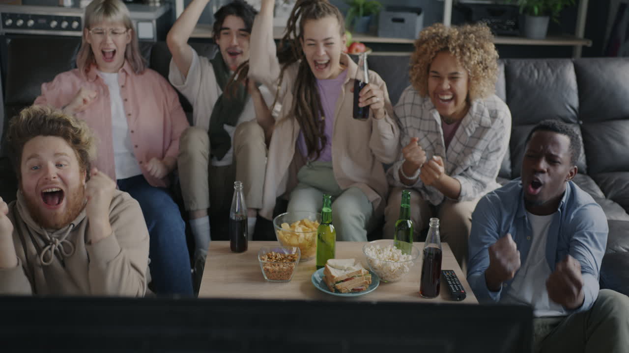 Friends Watching TV and Celebrating