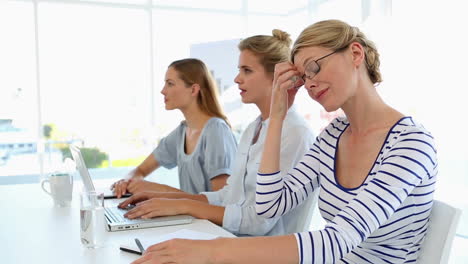 businesswomen listening to a presentation