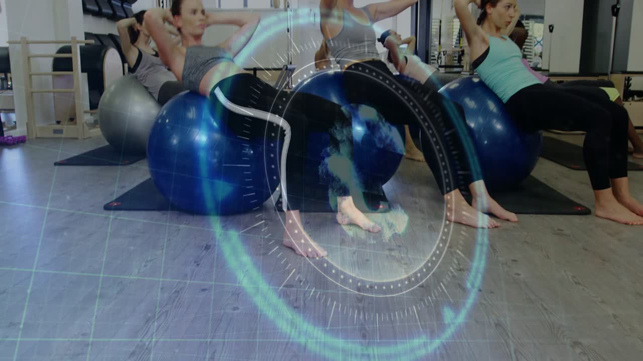 Women starting reclined on Swiss balls, doing synchronized fitness crunches with HUD guiding tempo