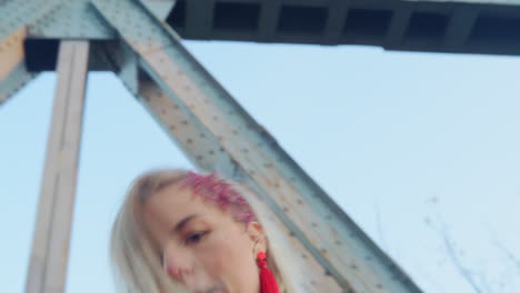 moving shot of dancing woman dressed in bright coloured dress