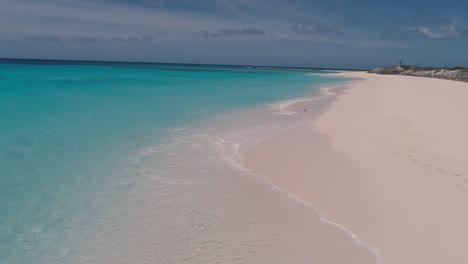 aerial footprint on white sand beach and couple in romantic glamping tent, paradise island los roques