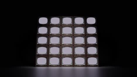 Set of retro TVs with no signal in dark studio