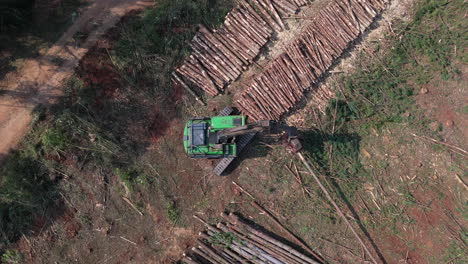 Aerial top down timber, clearing wood, extracting machine, Crane harvesting wood