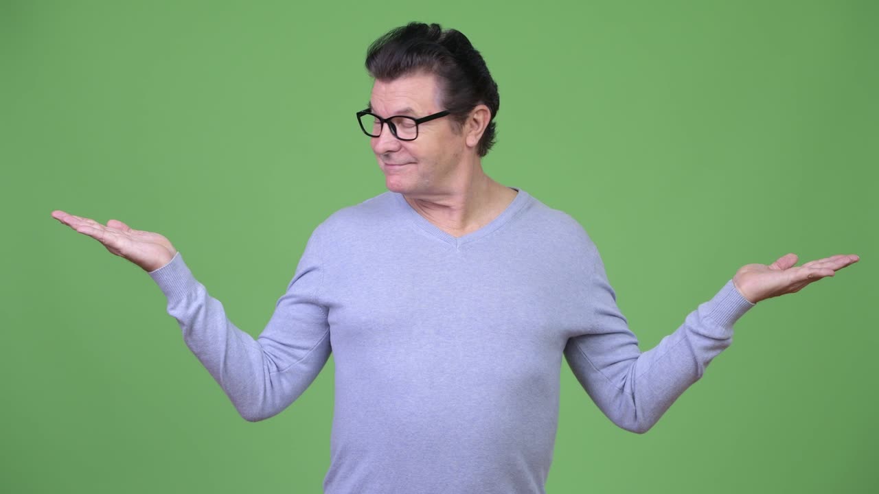 Senior handsome man choosing between left and right